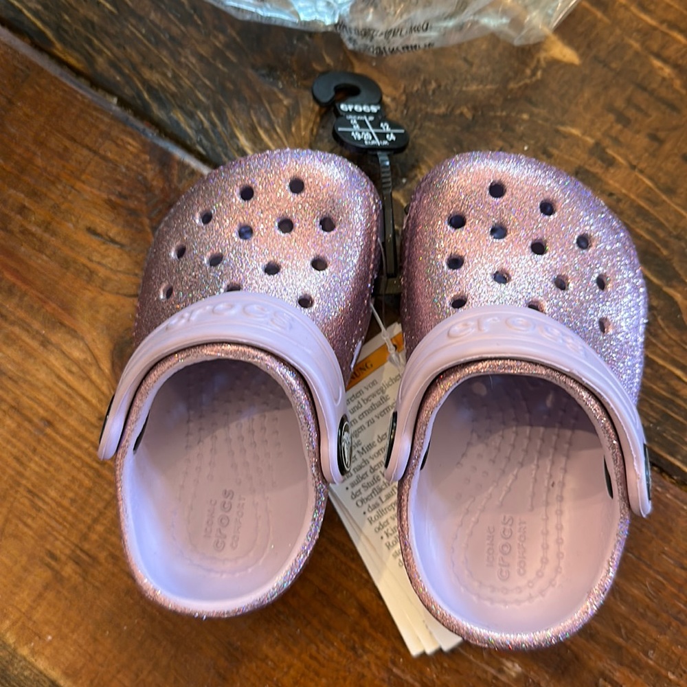 Lavender glitter crocs.